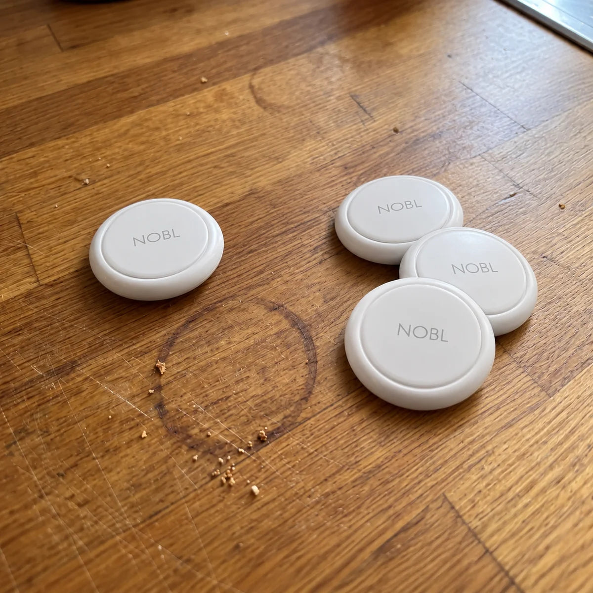 NOBL Air trackers on a wooden tabletop
