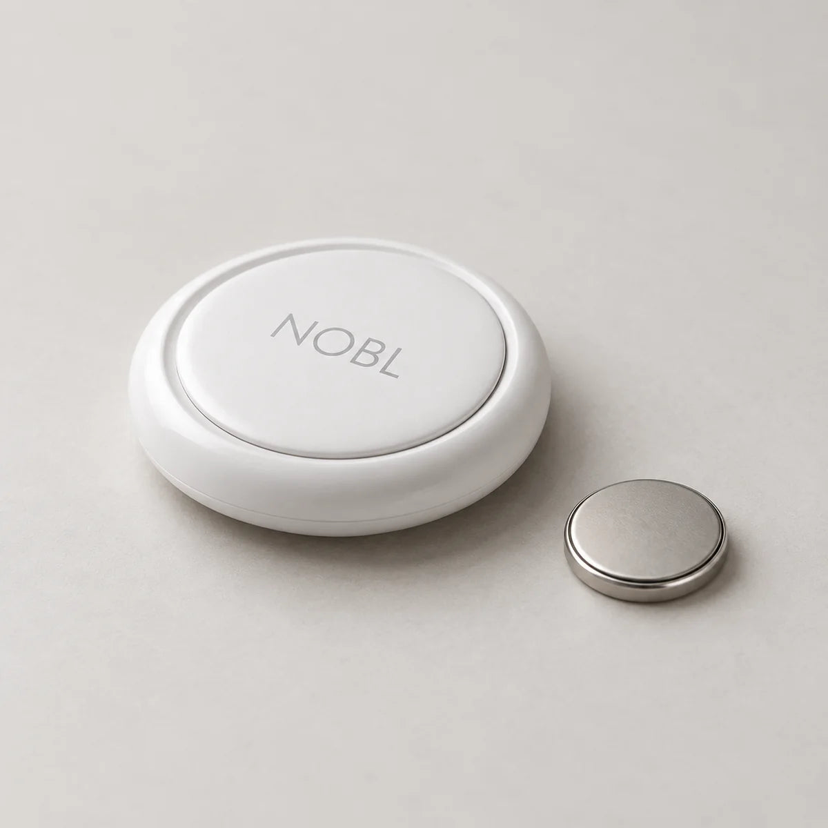 NOBL Air beside an unbranded replacement battery