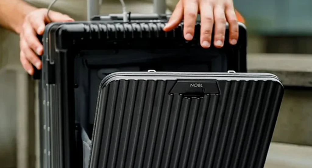 NOBL carry-on opened to show its front compartment