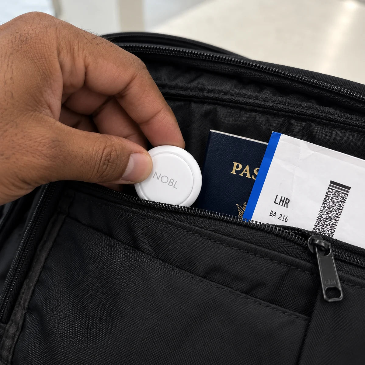 Traveler packing NOBL Air with everyday essentials